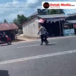 Spontan, Kapolres Basel Mendadak Turun Dari Mobil Dinas dan Bantu Anak SD Seberangi Jalan